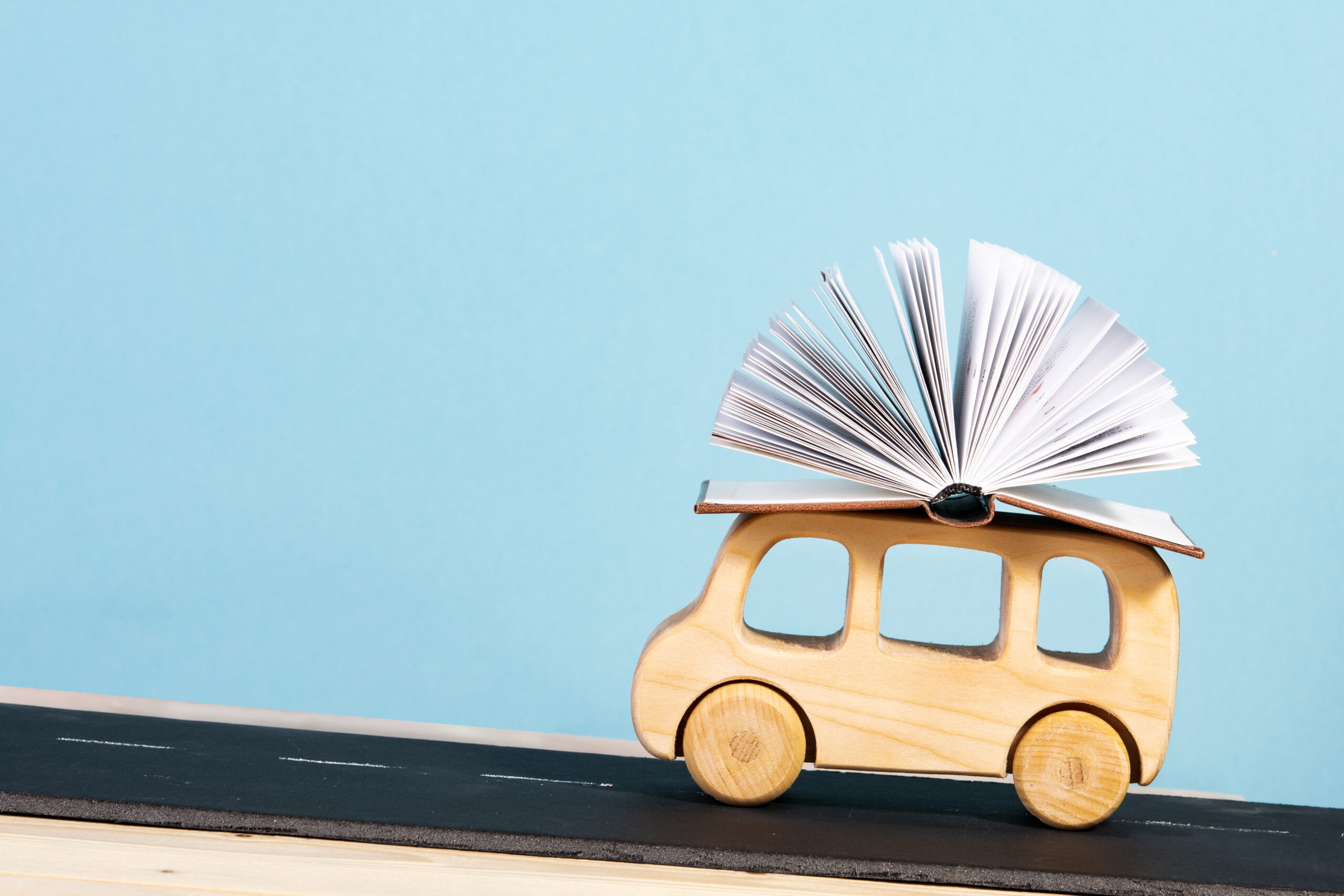 children's education. children's bus carrying a book